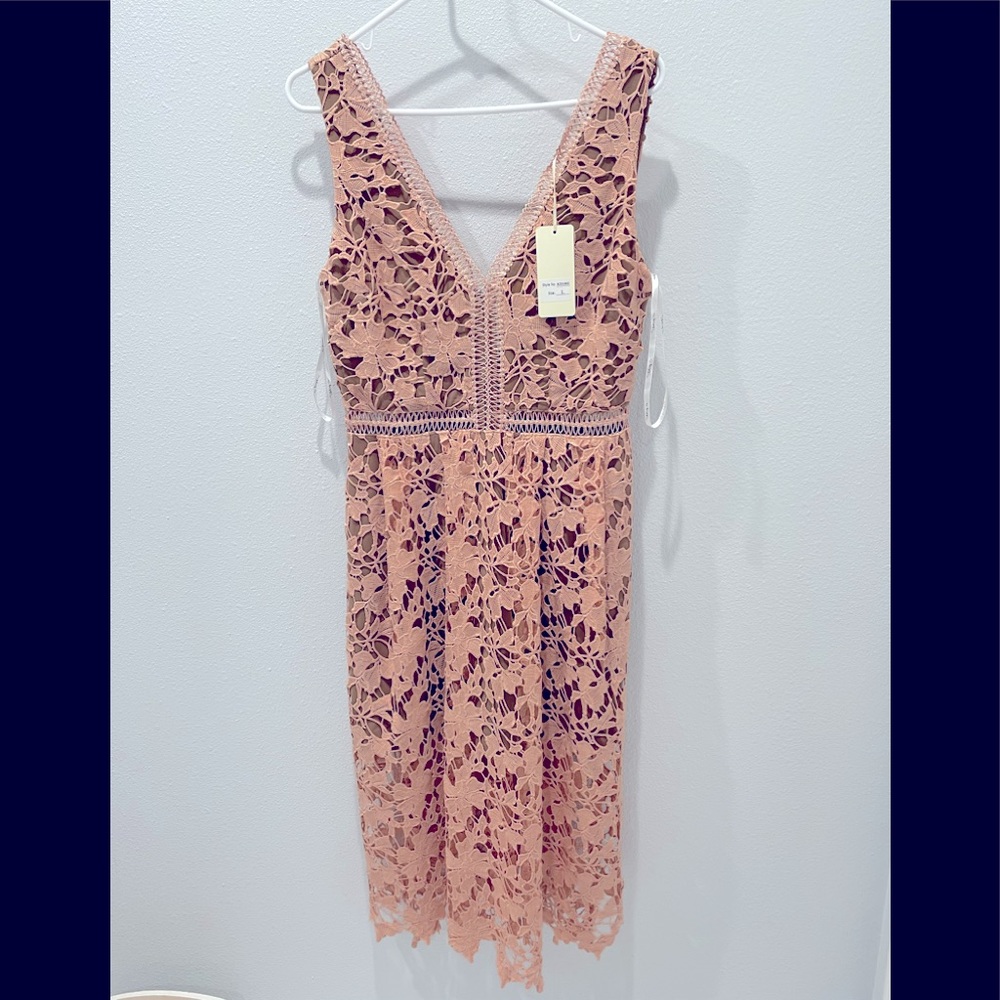 Sleeveless dress by The Clothing Company. Size L.